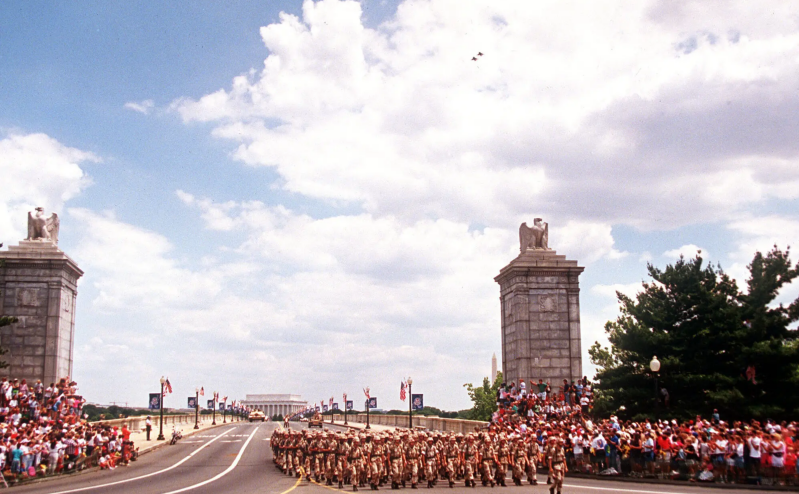 Troops marching on Memorial Bridge across the Potomac River toward the Pentagon during the National Victory Celebration parade in Washington on June 8, 1991
